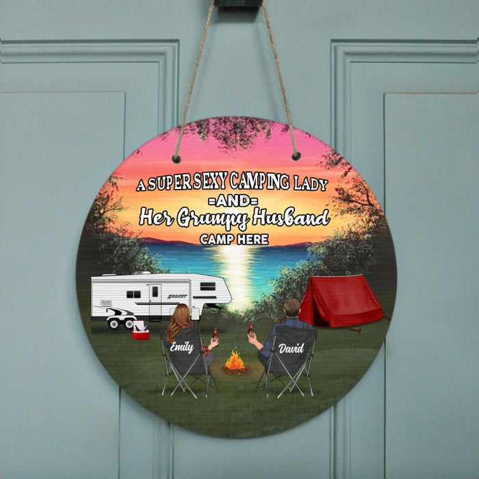 Custom Personalized Camping Door Sign - Gift Idea For Camping Lover - Couple/ Parents With Upto 3 Kids And 4 Pets - A Super Sexy Camping Lady And Her Grumpy Husband Camp Here
