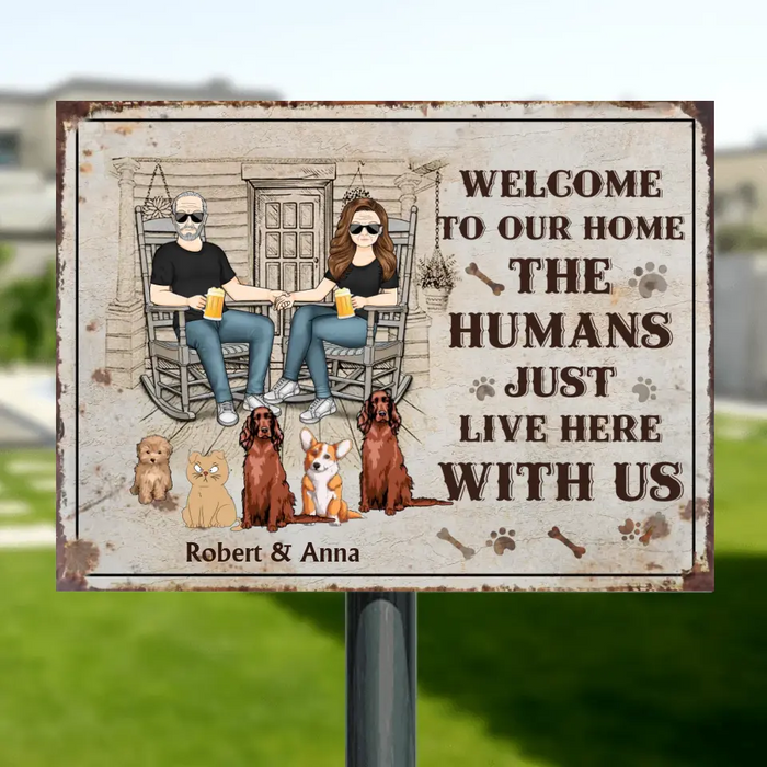 Custom Personalized Couple With Pets Metal Sign - Gift Idea For Mother's Day/Father's Day/Pet Lovers - Upto 5 Pets - Welcome To Our Home The Humans Just Live Here With Us